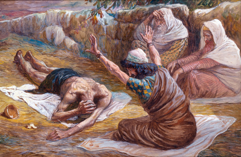 Job acostado sobre basura